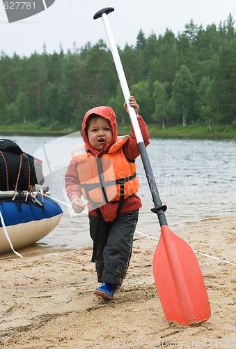 Image of Little boy with an oar
