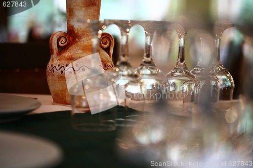 Image of A colorful pottery vase on a dinning table