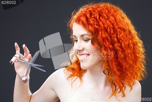 Image of redhead with scissors