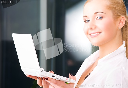 Image of happy businesswoman with laptop computer