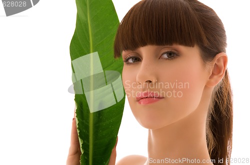 Image of woman with green leaf