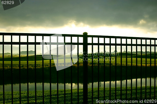 Image of Sunrise Behind the Fence