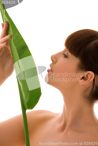 Image of woman with green leaf