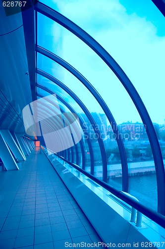 Image of glass corridor with bright-red window