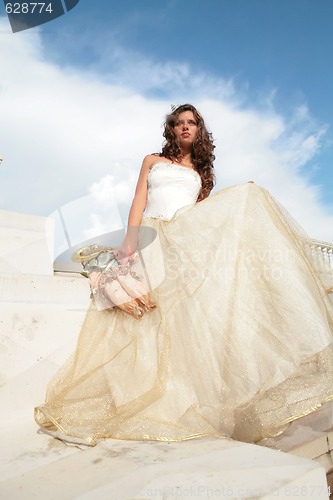 Image of dark-haired princess in white-golden gown