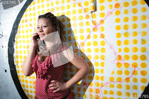 Image of girl talks on mobile phone