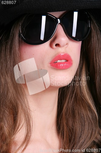 Image of portrait in black sunglasses