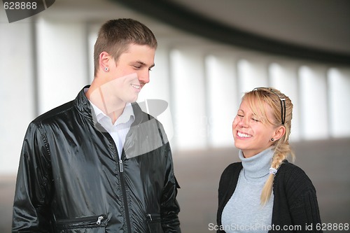 Image of smiling guy and laugh girl