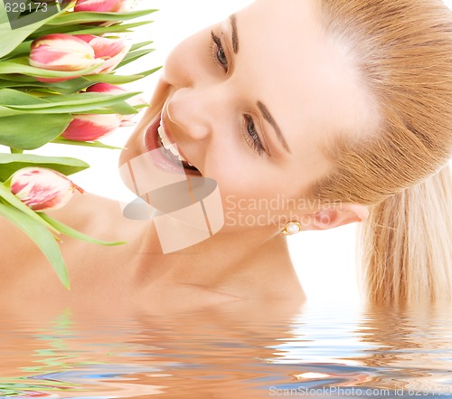 Image of happy woman with flowers