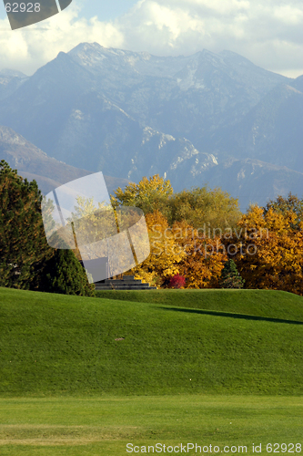 Image of Trees in a Park with Mountains on the Background