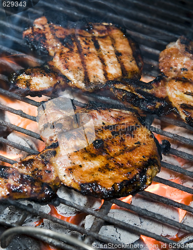 Image of pork chops on the barbecue grill