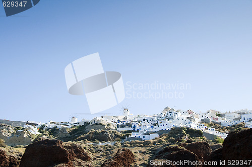 Image of oia santorini town built into volcanic cliffs panorama view