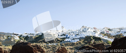 Image of oia santorini town built into volcanic cliffs panorama view
