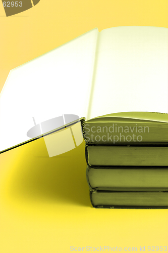 Image of Books Stacked Up - Yellow Background