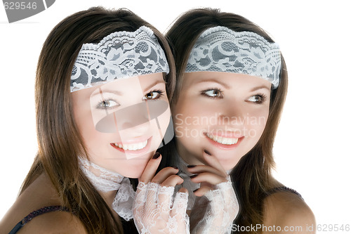 Image of Pretty girl and her reflection in a mirror