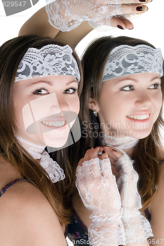 Image of Lovely girl and her reflection in a mirror