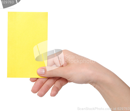 Image of yellow card in a hand