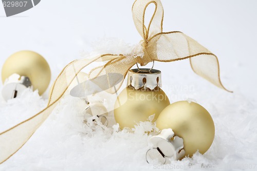 Image of Gold Christmas bauble decorations with ribbon.