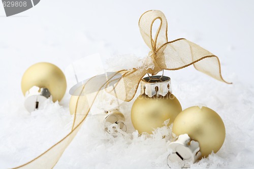 Image of Gold Christmas bauble decorations with ribbon.