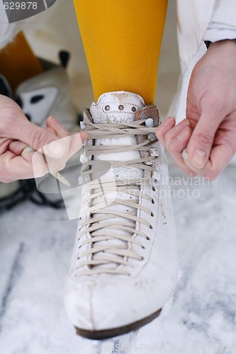 Image of Putting on ice skates.