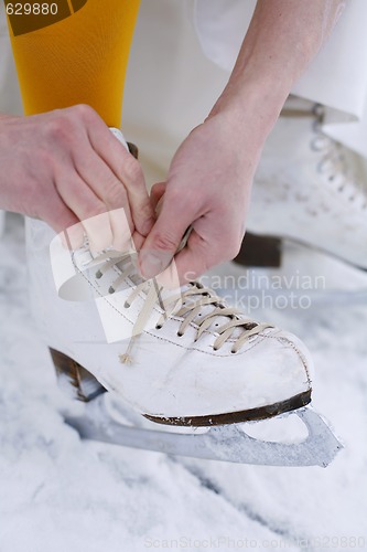 Image of Putting on ice skates.