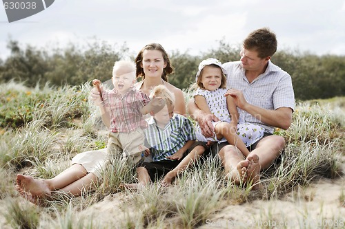 Image of Family enjoying themselves at the beach.