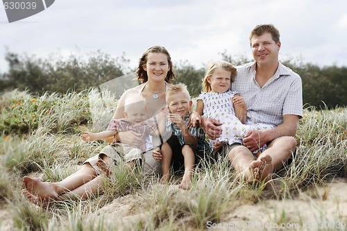 Image of Family enjoying themselves at the beach.