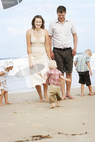 Image of Family enjoying themselves at the beach.