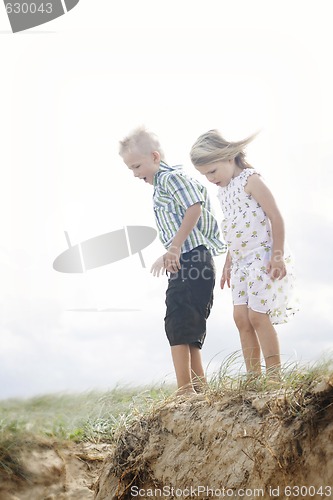 Image of Brother and sister together at the beach.