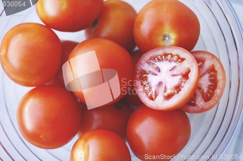 Image of Fresh tomatoes in a glass bowl.