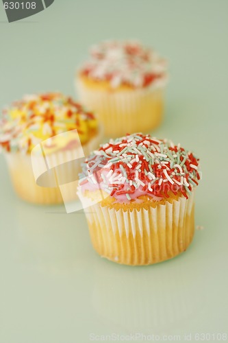 Image of Brightly colored cupcakes.