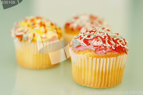 Image of Brightly colored cupcakes.