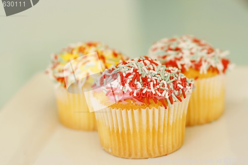Image of Brightly colored cupcakes.