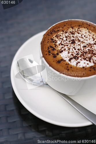 Image of Delicious cappuccino in a white cup.