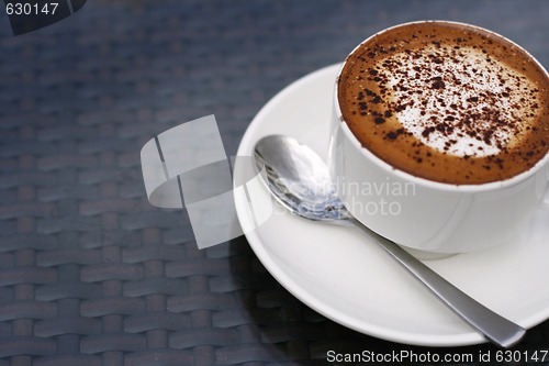 Image of Delicious cappuccino in a white cup.