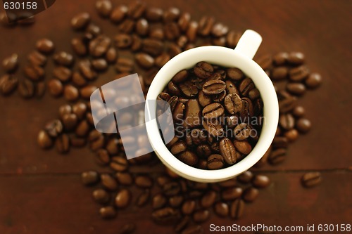 Image of Coffee cup with beans.