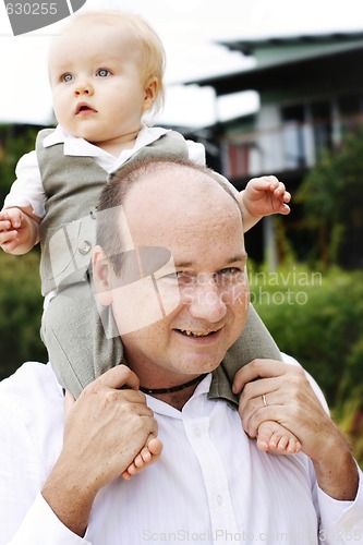 Image of Close-up portrait of a father and son outdoors.