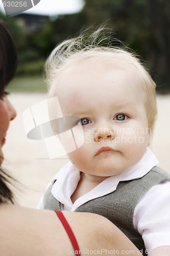 Image of Close-up portrait of a mother and son outdoors.