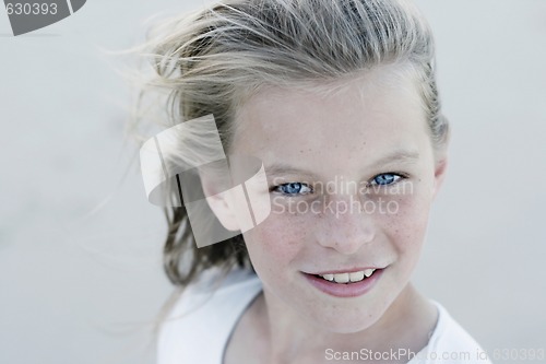 Image of Close-up portrait of a pretty, blonde haired teenage girl outdoo