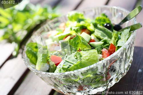 Image of Fresh garden salad on a table.