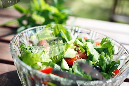 Image of Fresh garden salad on a table.