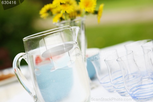 Image of Jug of water and glasses on a table.