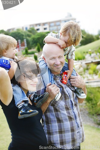 Image of Happy family outdoors.