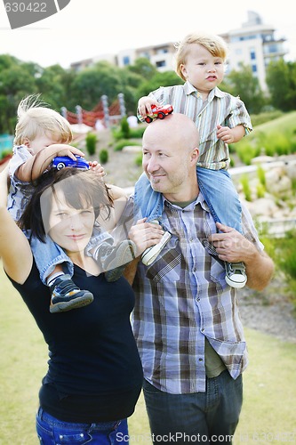 Image of Happy family outdoors.