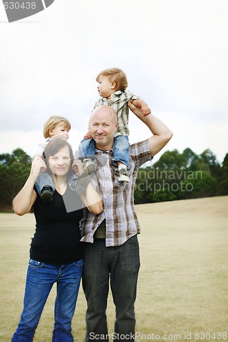 Image of Happy family outdoors.