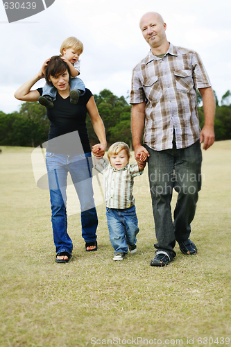 Image of Happy family outdoors.