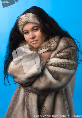 Image of young woman in fur coat