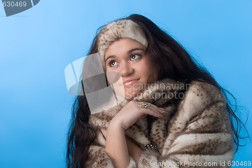 Image of young woman in fur coat
