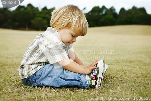 Image of Little boy in a park.