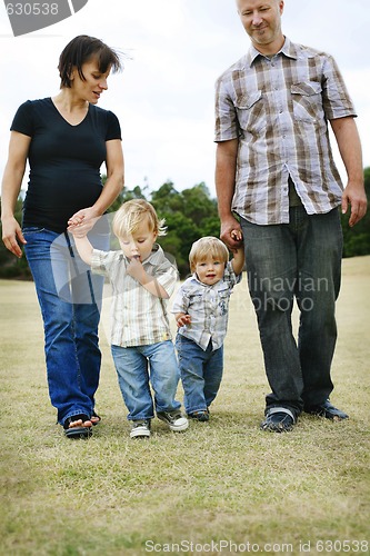 Image of Happy family outdoors.